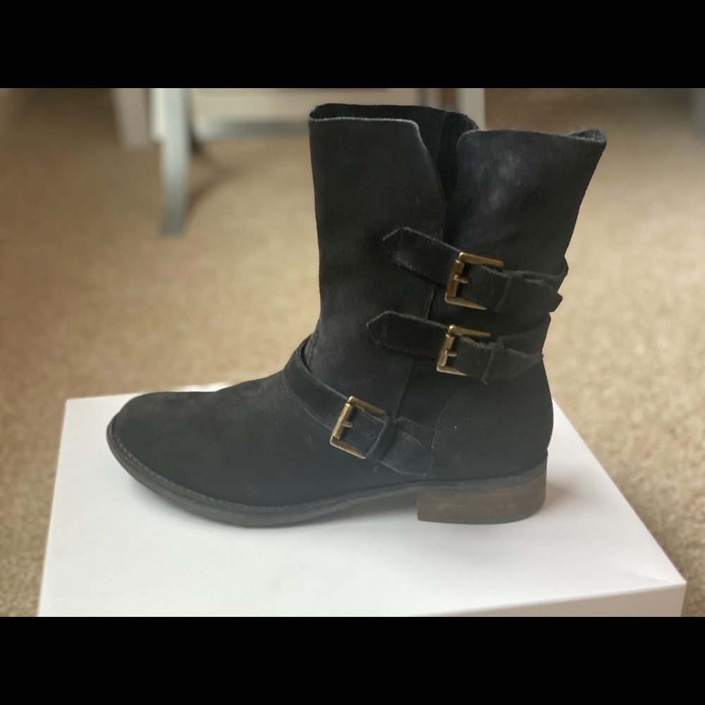 Trendy three buckle Steve Madden women’s boots.